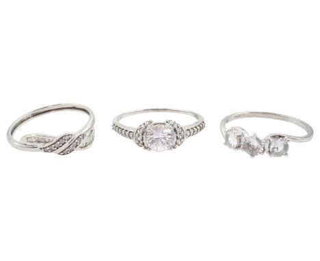 White gold diamond crossover ring and two white gold cubic zirconia rings, all 9ctCondition Report:Approx 6.05gm, one stone m