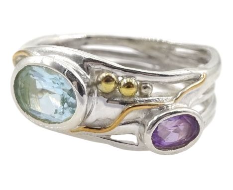 Silver and 14ct gold wire blue topaz and amethyst ring, stamped 925Condition Report:Size R-S, max depth = 8mm, good condition