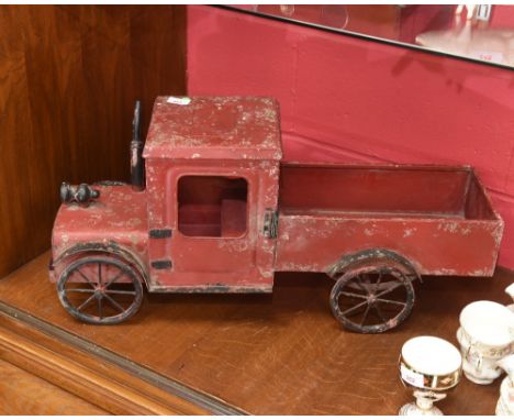 A  vintage red painted tin toy truck