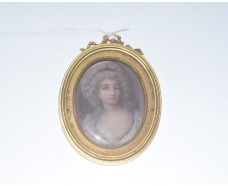 A portrait miniature in late 18th century style, c. 1900, of a young lady in powdered hair, on ivory, oval, in a gilt brass f