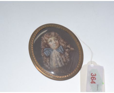 A portrait miniature on ivory of a wigged gentleman in lace cravat, oval, in a gilt brass frame frame with old paper label ve