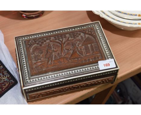 A carved and bone inlaid jewellery box