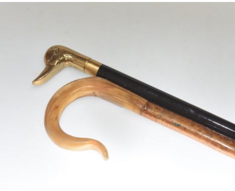 A walking stick tog. with a flask stick, the handle a ducks head. (2)