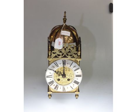 A 19th century brass lantern clock with silvered chapter ring and Roman numerals, the eight day movement signed R & C