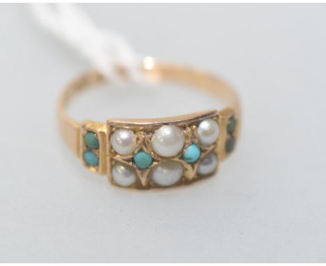 A 15ct gold turquoise and seed pearl ring, the turquoise beads and seed pearls in a plaque setting on a tapering yellow gold 