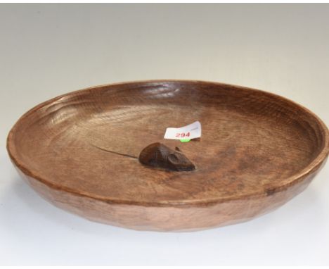 A Robert Mouseman Thompson oak fruit bowl, adzed and with carved mouse signature to well. 29cm diameter