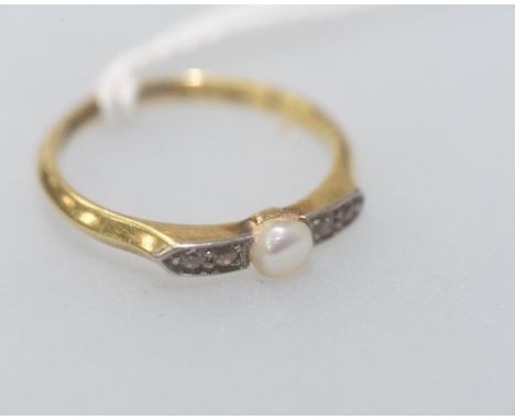 A seed pearl and diamond ring on an 18ct gold band