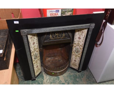 A fire inset; tog. with a tiled fire surround