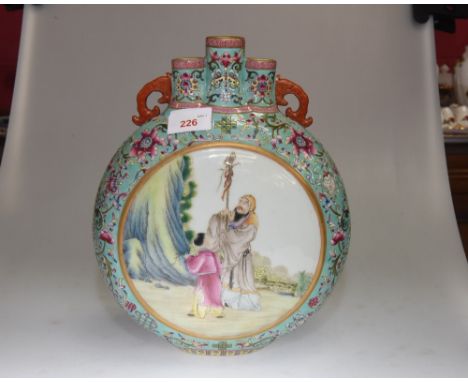 A Chinese porcelain famille rose moon flask vase, decorated with figures and with four character mark to base.