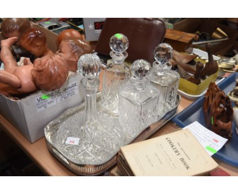 A pair of cut glass decanters, a ship's decanter and another (4)