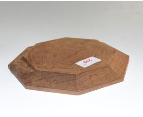 A Robert Mouseman Thompson oak teapot stand, octagonal and with carved mouse signature. Diameter 19cm