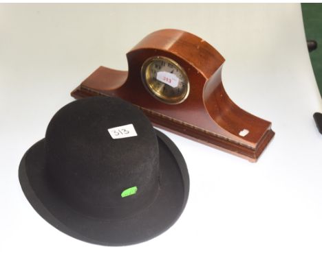 A mahogany mantel clock and a bowler hat (2)