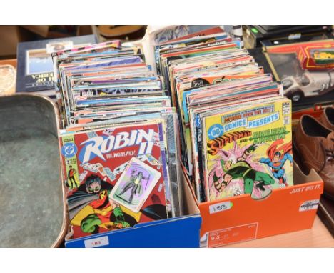 A large group of DC comic books in two boxes inc. Batman; Superman; The Green Arrow; Suicide Squad and many more.