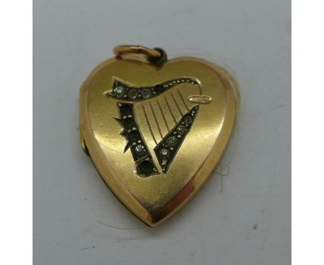 A 9ct gold back and front locket with harp decoration, a/f
