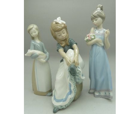 Two Lladro figures, girl with flowers, a girl with a pig and a Nao figure, height of tallest 21.5cm