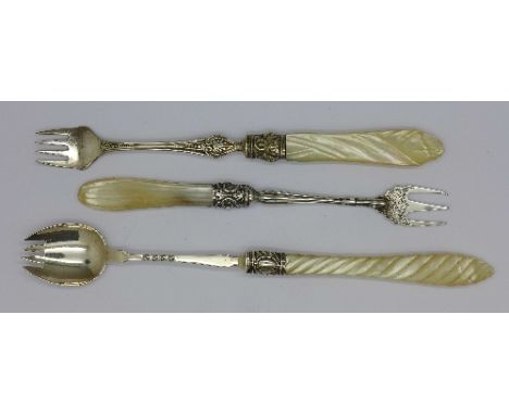 A Victorian silver pickle fork, Birmingham 1863 and two other pickle forks with mother of pearl handles