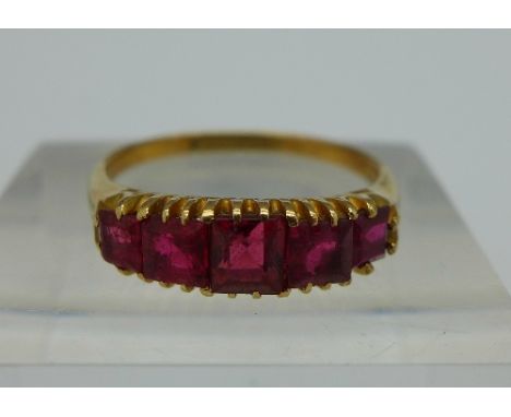 A yellow metal and red stone ring, weight 3.3g, size O