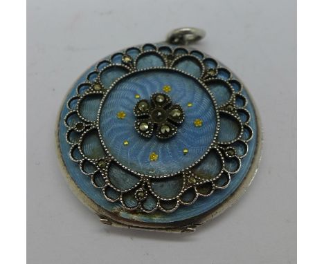 A silver, enamel and marcasite set locket