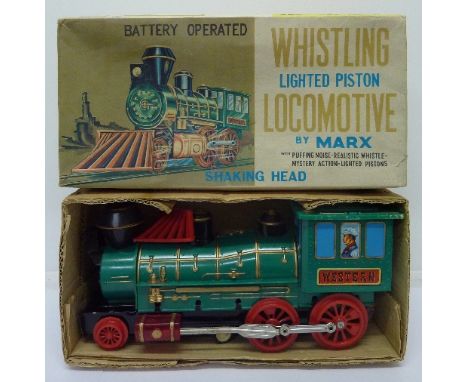 A Marx battery operated whistling lighted piston locomotive, boxed