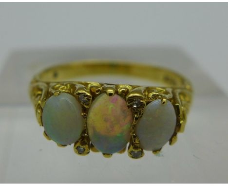 An 18ct gold, opal and diamond ring, weight 3.9g, size M