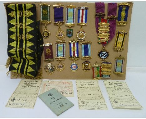 A collection of Buffalo medals and a sash