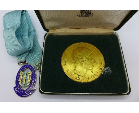 A silver and enamel medal and Prince of Wales medallion