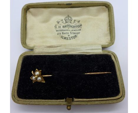 An 18ct gold and seed pearl stick pin