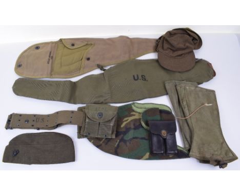 US MILITARY EQUIPMENT; 2x US army gun covers one dated 1943 other 1944, camo helmet cover, pair of gaiters dated 194 size 2R 