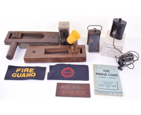 WW2 HOME FRONT ITEMS; two printed armbands FIRE GUARD and EMERGENCY ROAD REPAIRS, morse code book, black out lamp in box, hel