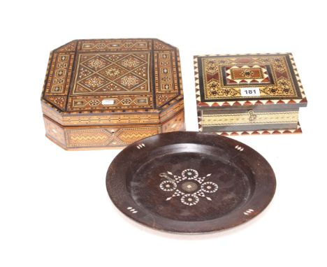 Two inlaid wooden boxes and a mother of pearl inlaid plate (3).