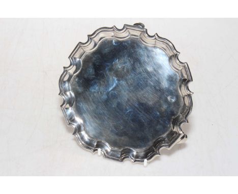 Georgian silver card tray with Chippendale border, London 1735, 16cm diameter.