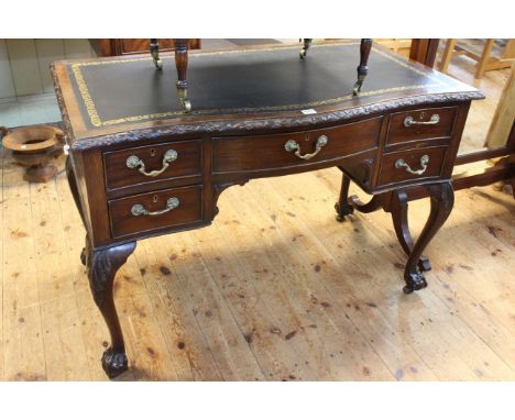 Early 20th Century mahogany Chippendale style five drawer serpentine front writing table on ball and claw cabriole legs, 74cm