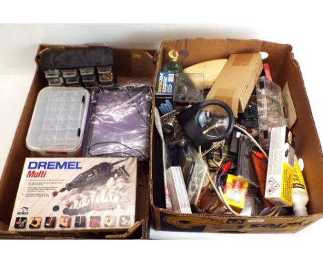 Two boxes of crafting tools and accessories, multi dremel, magnifier, soldier iron, mini tool kits and accessories 