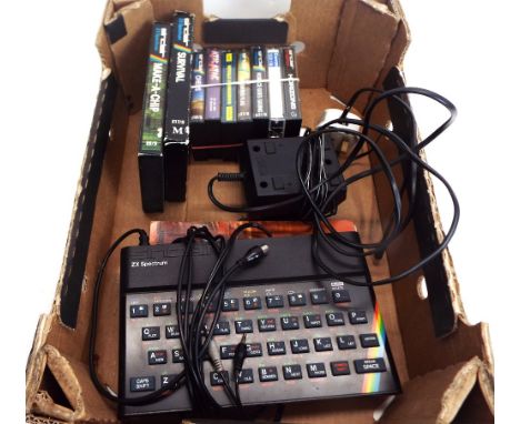 Sinclair ZX Spectrum with instruction manual and a collection of games 