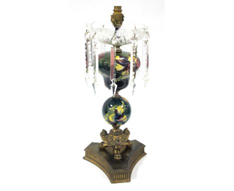 A Moorcroft Pottery Table Lamp, painted in the 'Hibiscus' pattern against a green ground, the shaped bowl and globular stem o