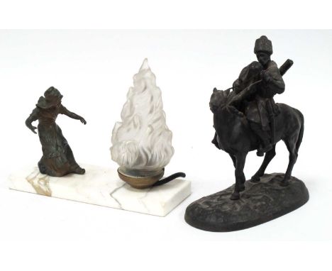 An Art Deco Table Lamp, modelled as speltre girl wearing a long dress and bonnet, the flame shade upon a white marble base, 2