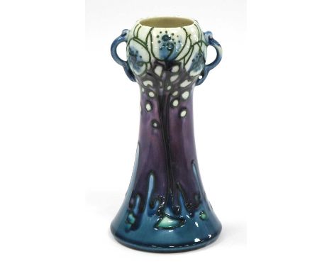 A Minton Secessionist Pottery Vase, with swirling twin handles, the tapered body painted in foliate pattern in blue and purpl