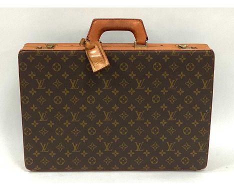 Louis Vuitton: An Attache/Brief Case, in monogram brown canvas with tan leather trim, inner document compartment in the lid, 