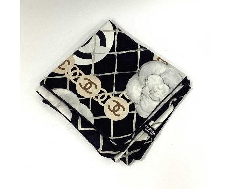 Chanel; A Silk Square Scarf, in a stylised grey camellia design on a black ground with CC logo border, labelled 'Chanel Made 