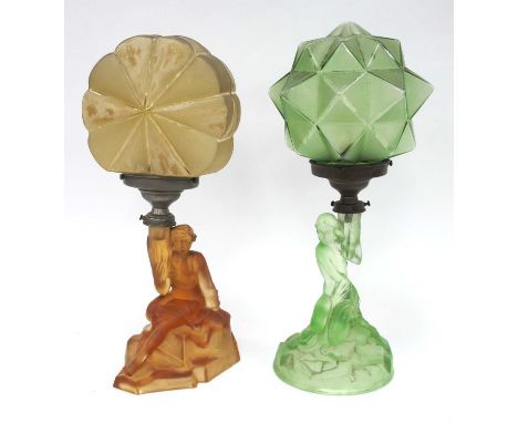 An Art Deco Frosted Green Glass Table Lamp, modelled as a naked lady kneeling on rocks, her arm aloft to hold the faceted cir