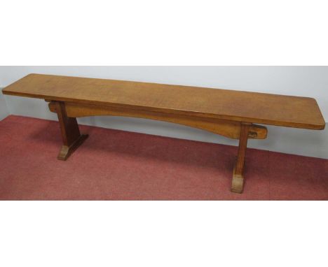 A Colin Almack 'Beaverman' Oak Bench, the rectangular top raised on shaped supports, carved beaver signature, 168cm wide, 27c