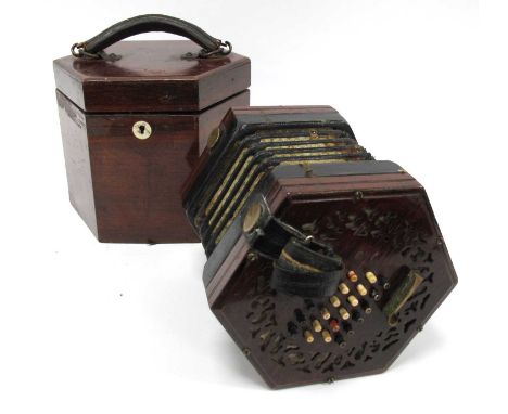 An Early XX Century Concertina, forty-eight bone English system keys, fretwork ends, serial number 58112, the wooden box with