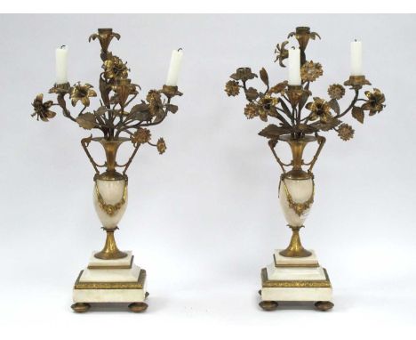 A Pair of White Marble and Gilt Metal Late XIX Century Candelabra, each with four scrolled floral candle arms issuing from ur