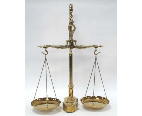 A Pair of Decorative Brass 'Maco Braga' Scales, with dolphin form beam, balance hung with circular trays, the shaped base con