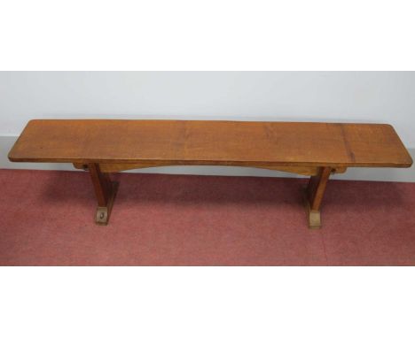 A Colin Almack 'Beaverman' Oak Bench, the rectangular top raised on shaped supports, carved beaver signature, 168cm wide, 27c