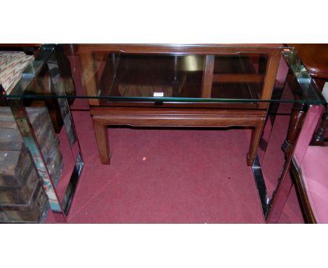 A contemporary flat-sided chrome and clear glass topped console table, w.110cm