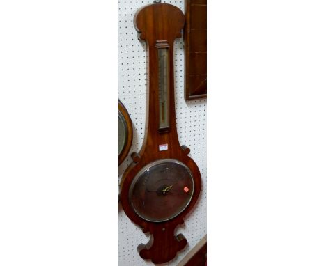 An early 19th century mahogany onion topped two dial wheel barometer, the silvered dial signed Cahoon Bros, 16 Castle Place, 
