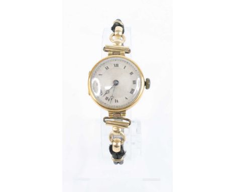 A lady's vintage 18ct gold cased manual wind wristwatch, case dia.24mm, on woven thread bracelet 