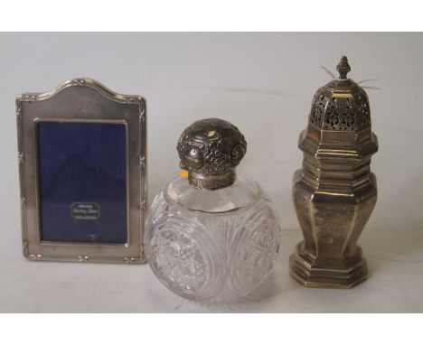 An Edwardian silver sugar caster, of octagonal baluster form, London 1907, 3.6ozt; together with a silver clad easel phonogra