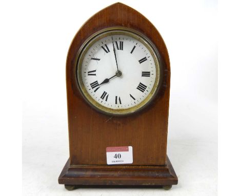 An Edwardian mahogany lancet mantel clock, the enamelled dial showing Roman numerals, h.21cm 